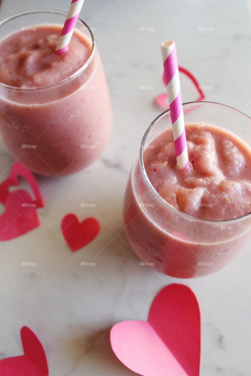 Sweet pink Valentine's Day fruit smoothies.