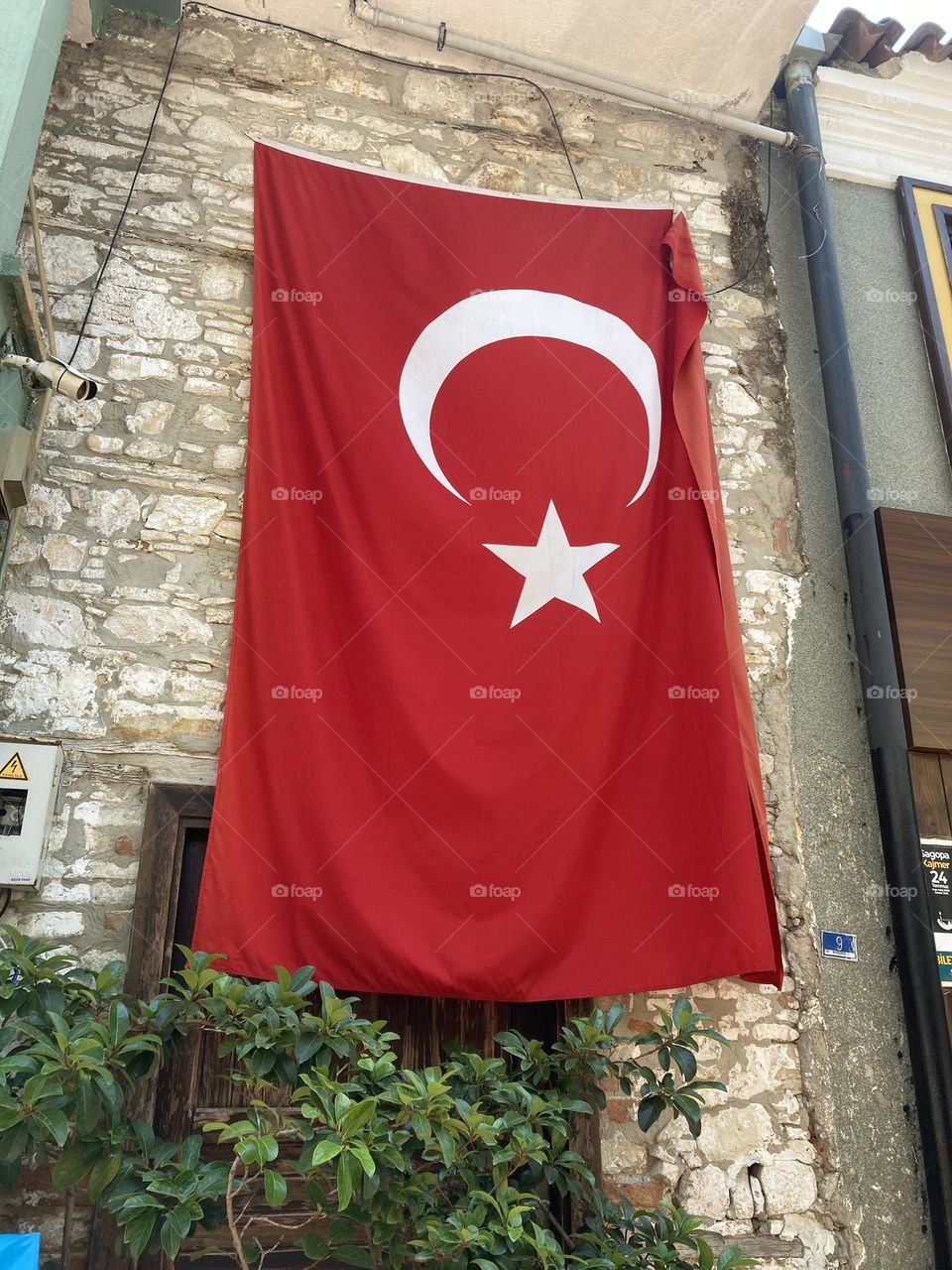 Summertime in Kusadasi, Turkey. Sunny day in charming sunny city. Ocean and blue sky. Colorful lovely city of Turkey. Summer vacation trips are my favorite. Turkey flag 