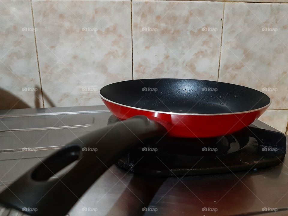 A frying pan on the stove.