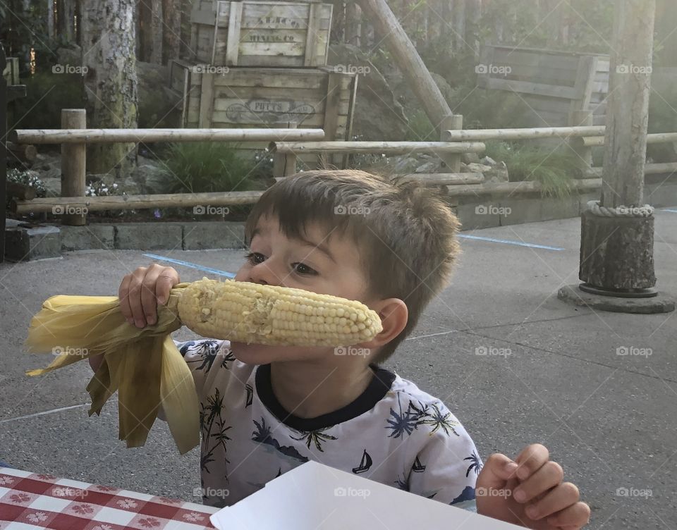 Toddler enjoying corn cob