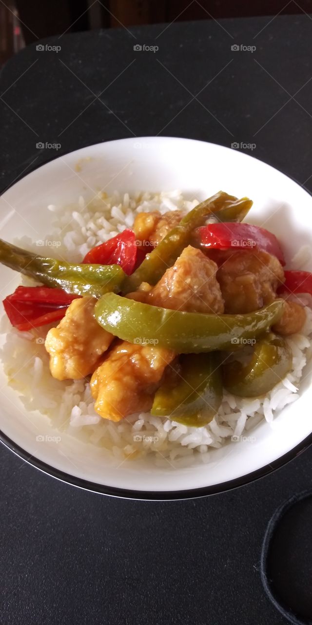 Teriyaki chicken with bell peppers.