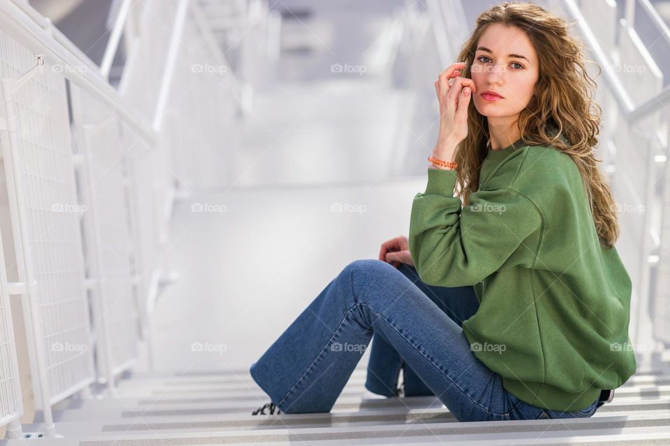 young woman with long curly hair