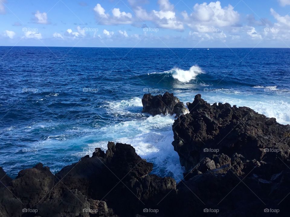 Blue skies, waves, and lava