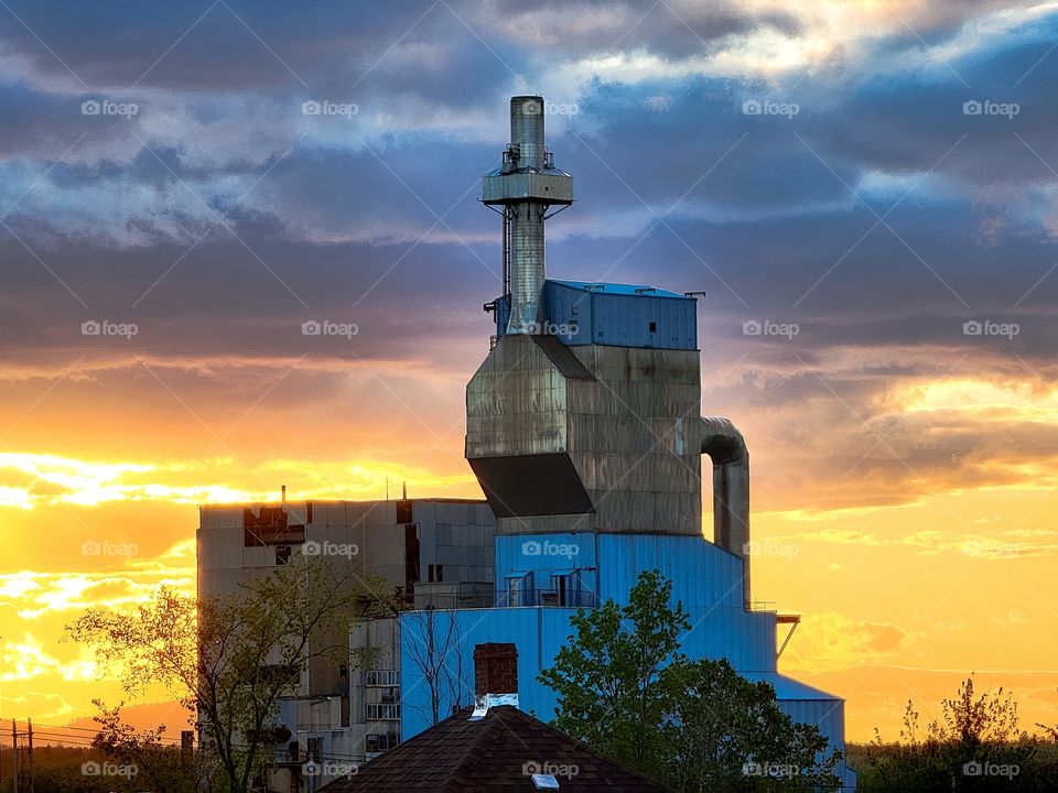 sunset on abandoned mill