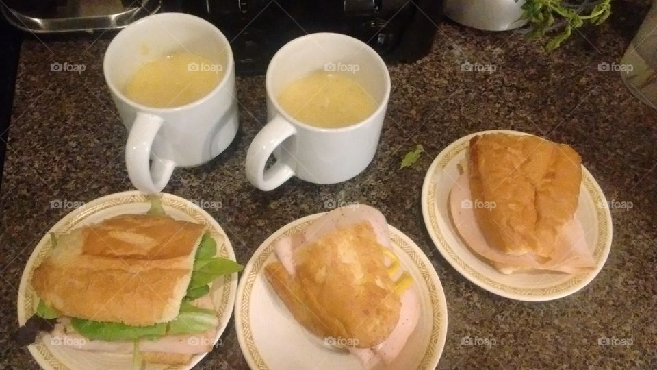 Cold, deli sandwiches, home-made with a cup filled with cream of chicken soup.