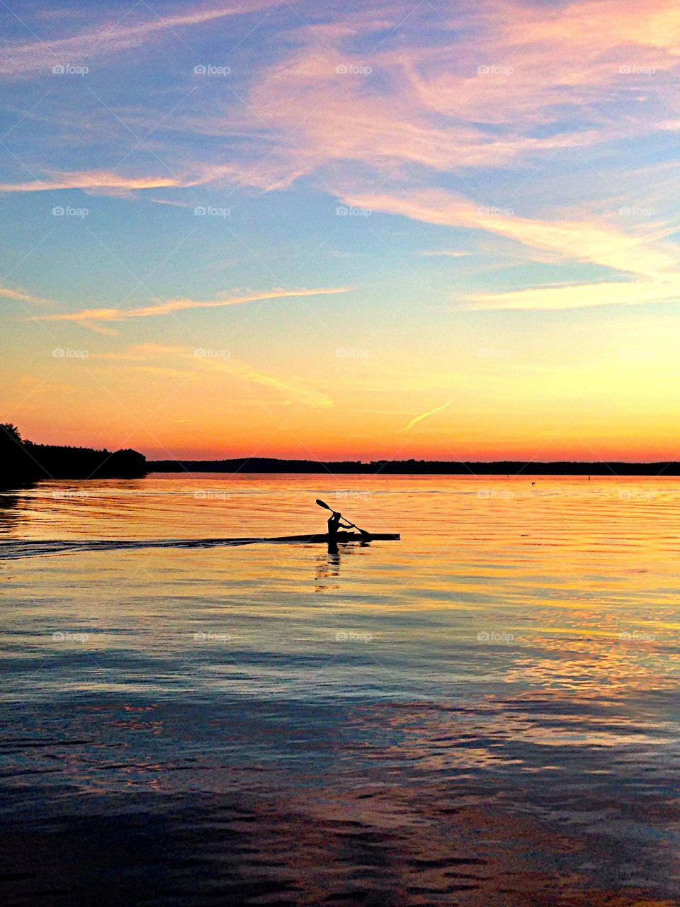 Person on canoe at sunrise
