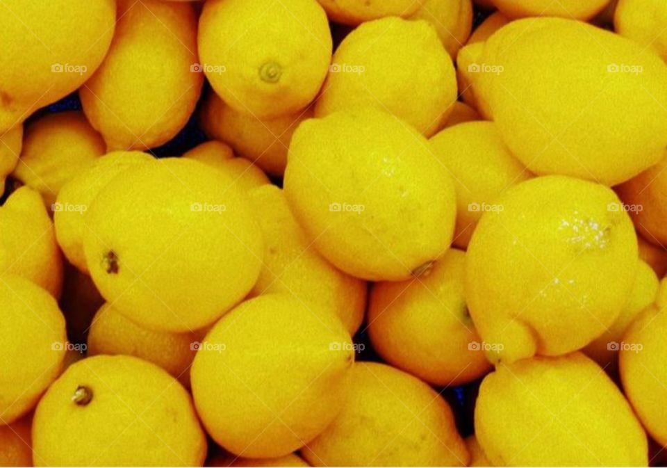Lemony yellow. A photo I took at a local store of lemons. My goal was to practice framing and filling my shot.