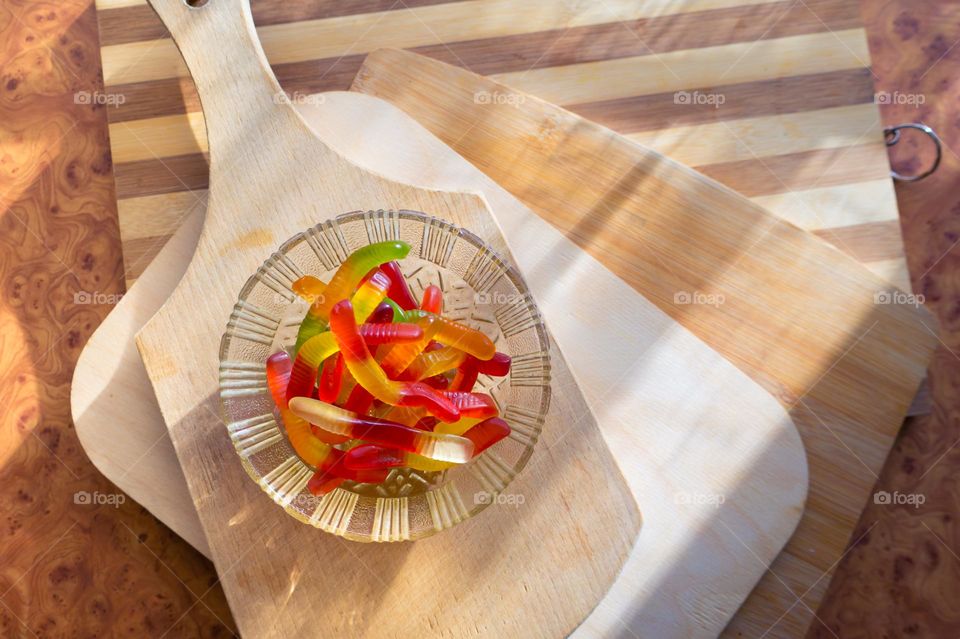 Jelly worms with sweet and sour taste. Sweets for children.