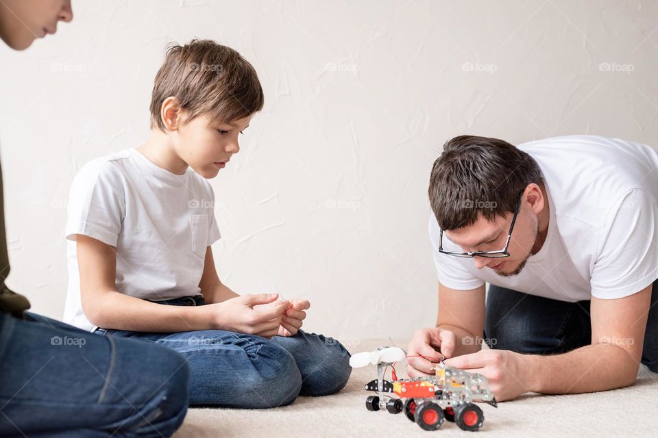 father playing games with children