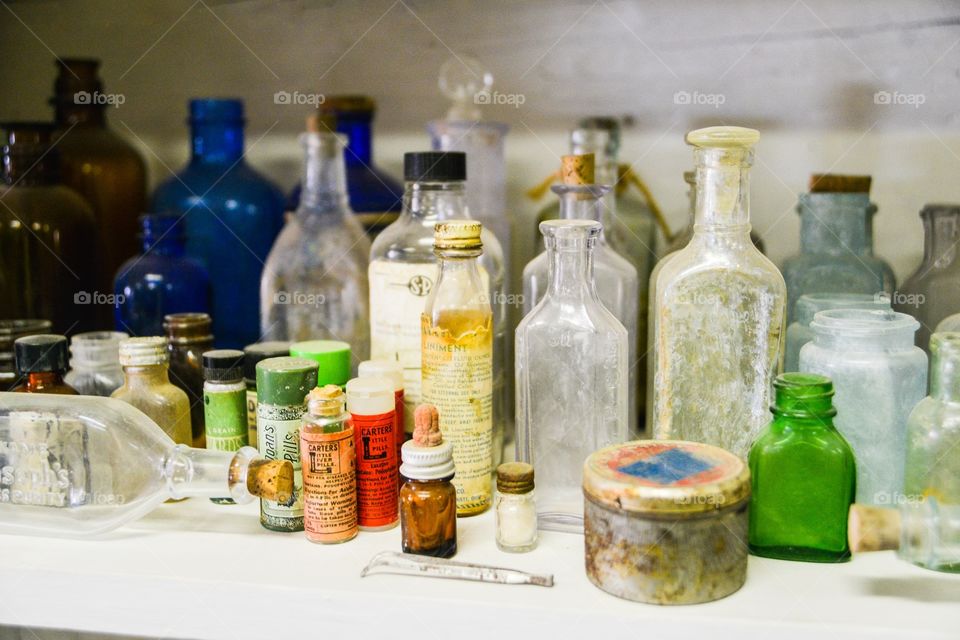 Collection of vintage bottles and tins