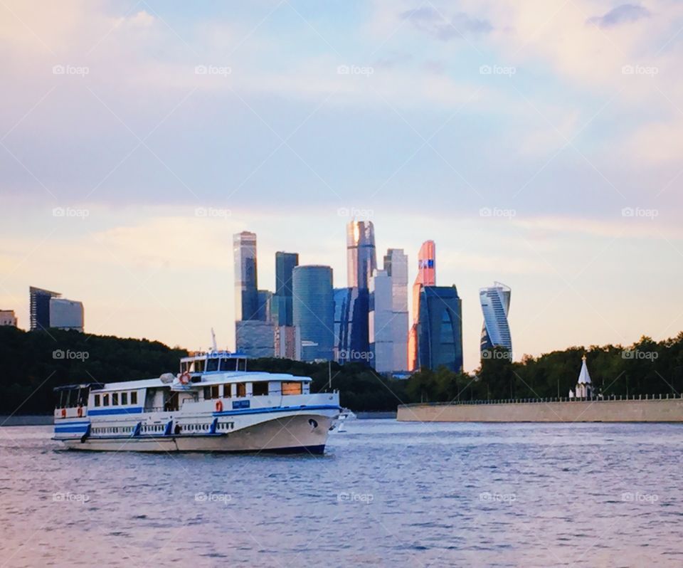 A view on Moscow city with a boat from river 