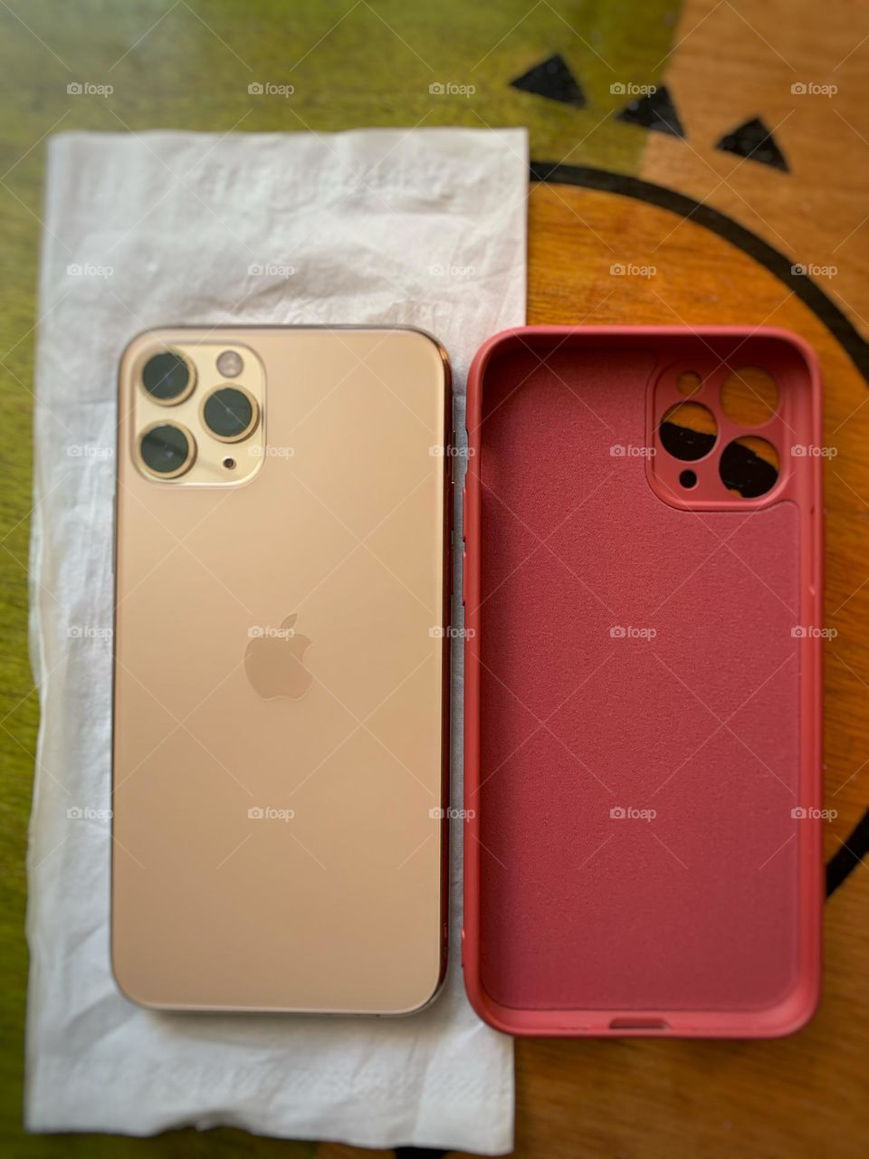 IPhone 11 Pro gold and red case cover.