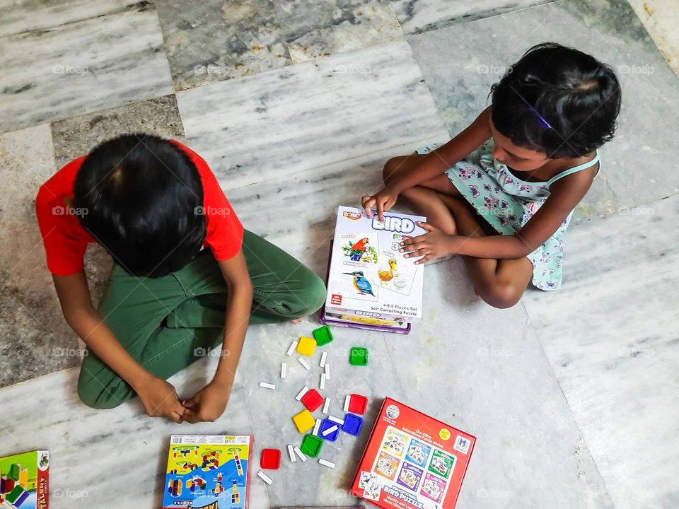 Kids playing inside the living room