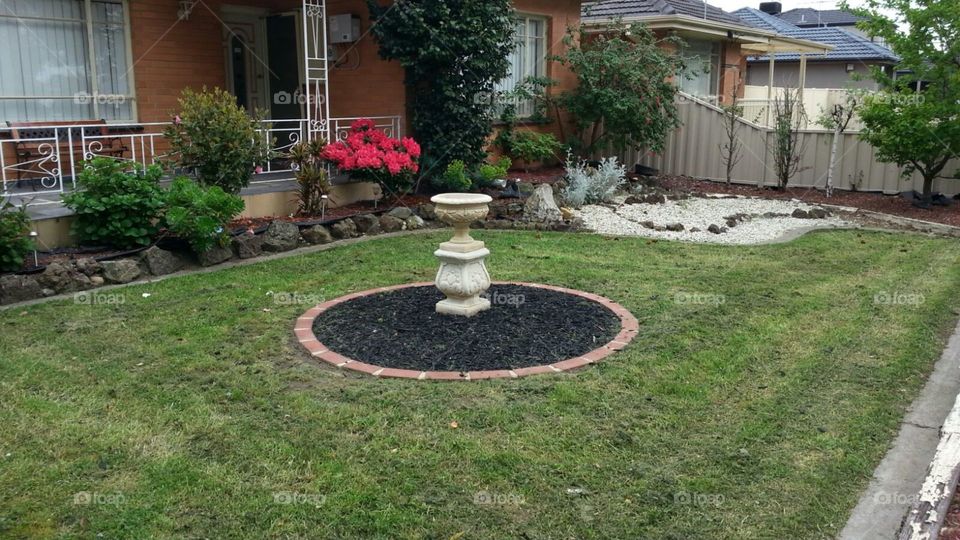 utiful land scaped front garden.