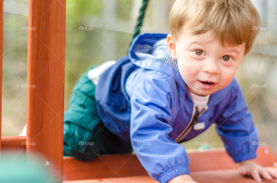 Little boy playing in playground