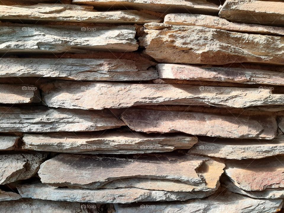 Rectangular cladding on a wall creates a rustic feel