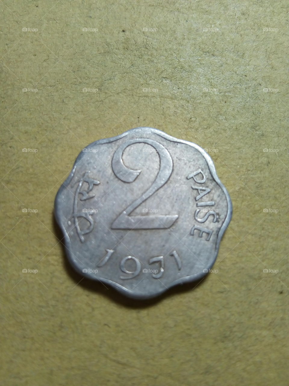 A coin of Two paise- 1/50 share of Indian Rupee issued by Government of India in 1971.