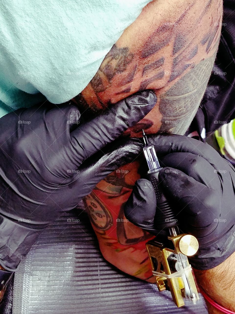 My best friend getting his tattoo sleeve finished.