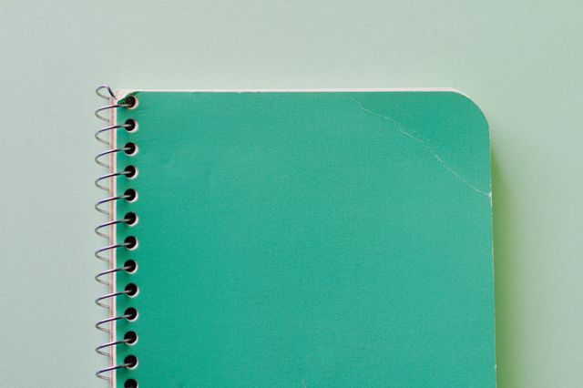 Elevated view of green spiral notebook