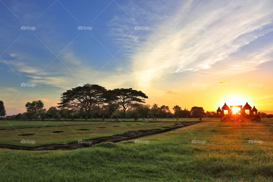 A beautiful scenary of green field at archaelogical site of ratu boko palace, Jogjakarta, Indonesia