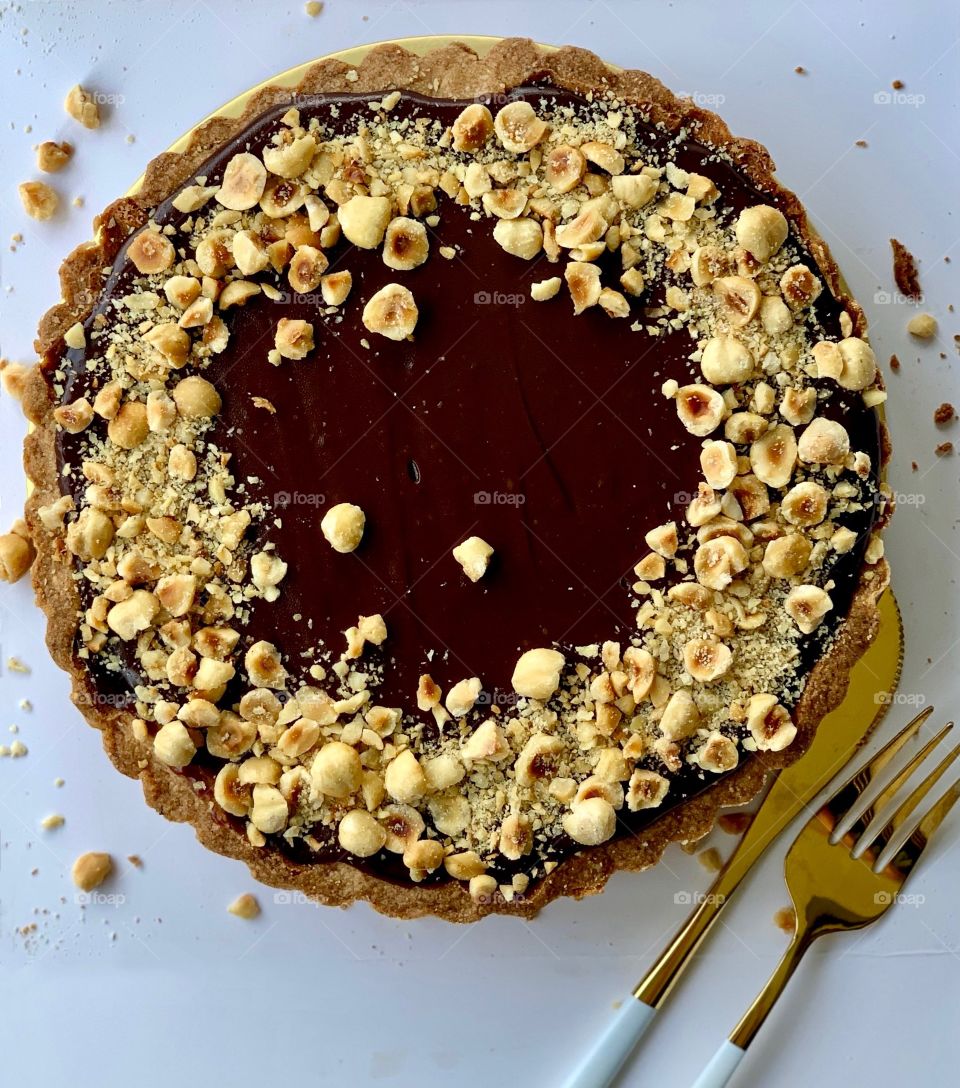Hazelnut Nutella chocolate tart with nuts 