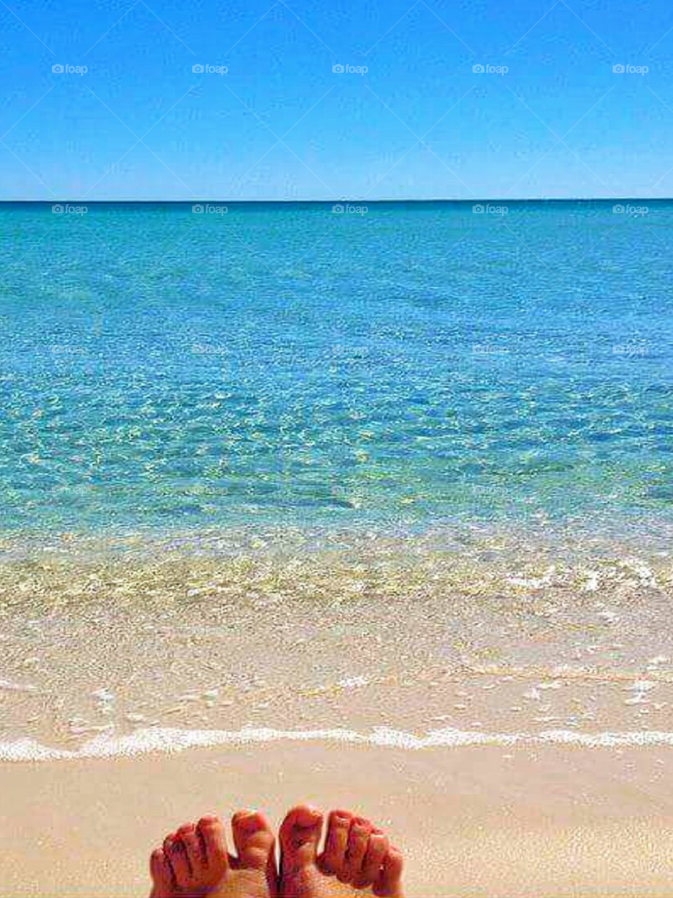 beautiful aqua color water with reflection on beach