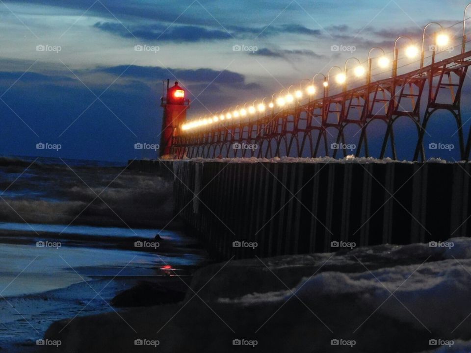 Sunset at the lighthouse. lit up as the sunset