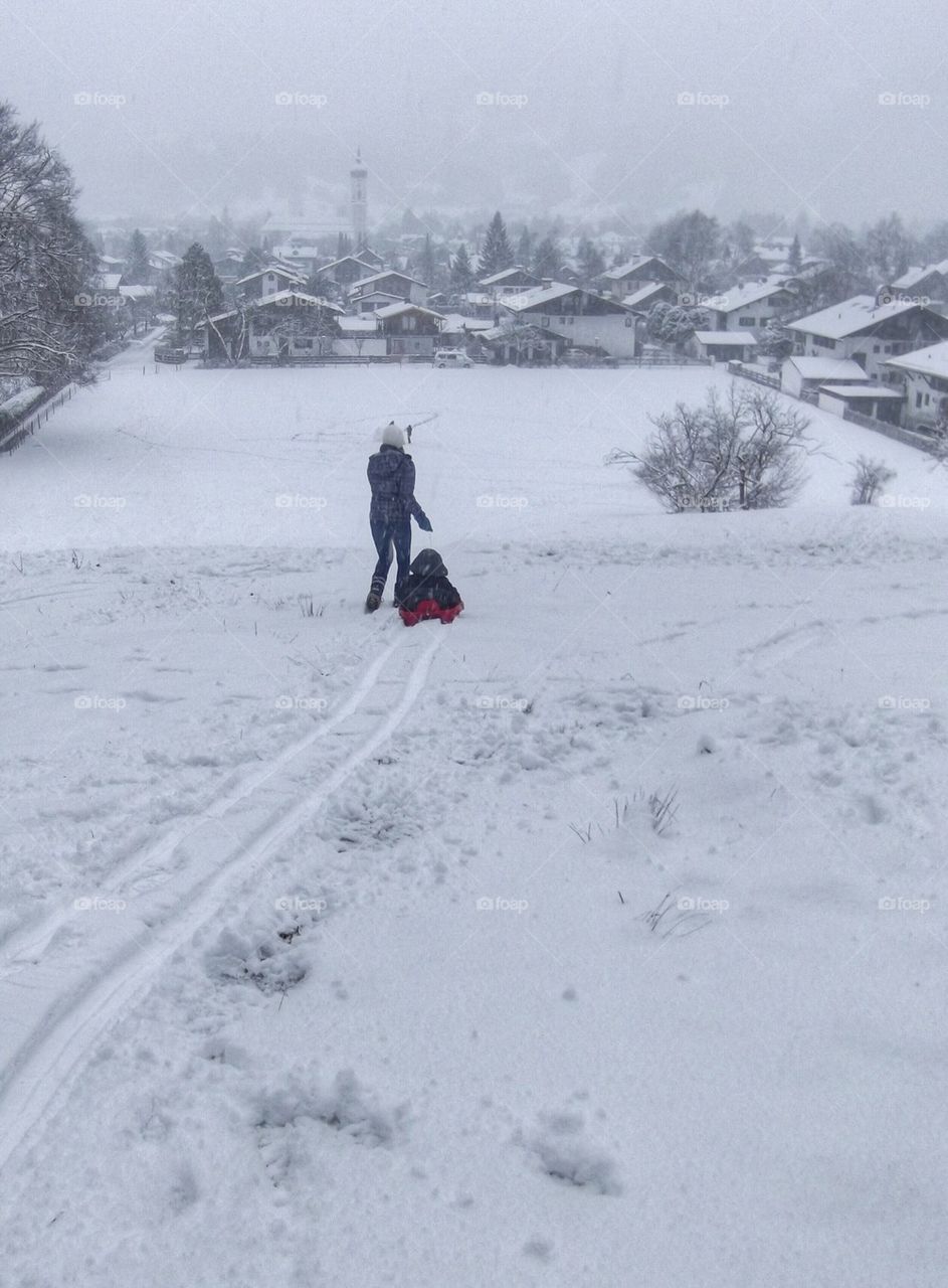 At the top of the sledding hill