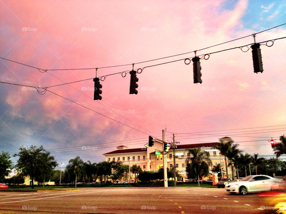 Street with traffic light at sunset