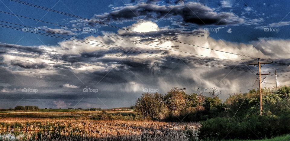large cloud over field.