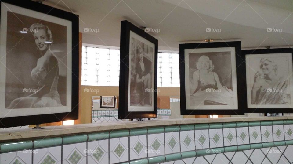 Pictures of Marilyn Monroe and others in Bathroom at restaurant in Brazil.