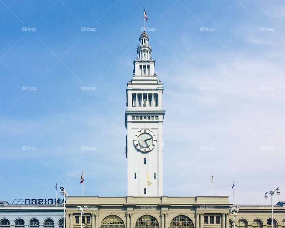 Upper part of Clock tower and blue sky