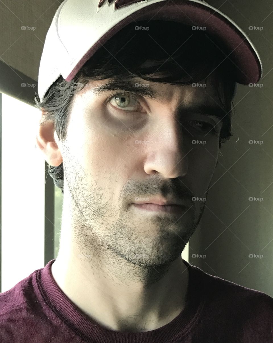 Young man looking off, thinking.