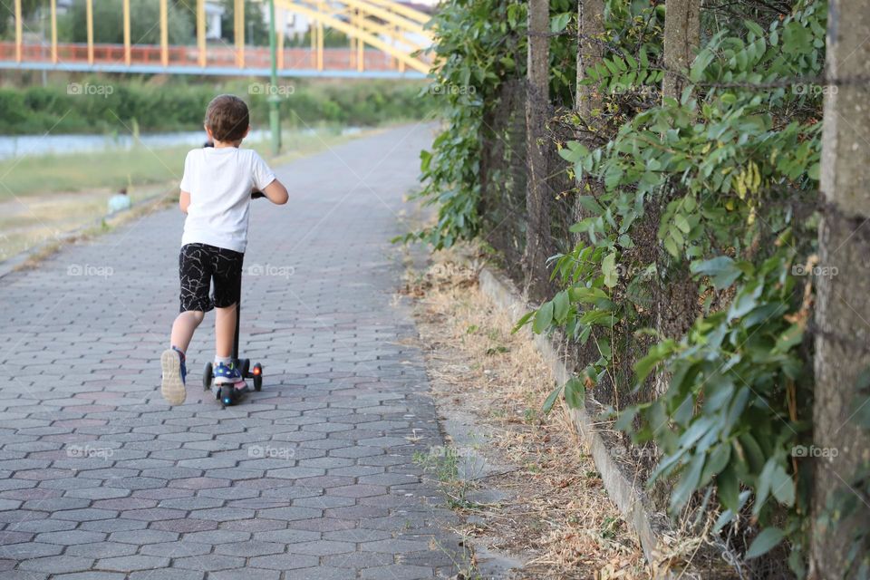 With scooter to kindergarten 