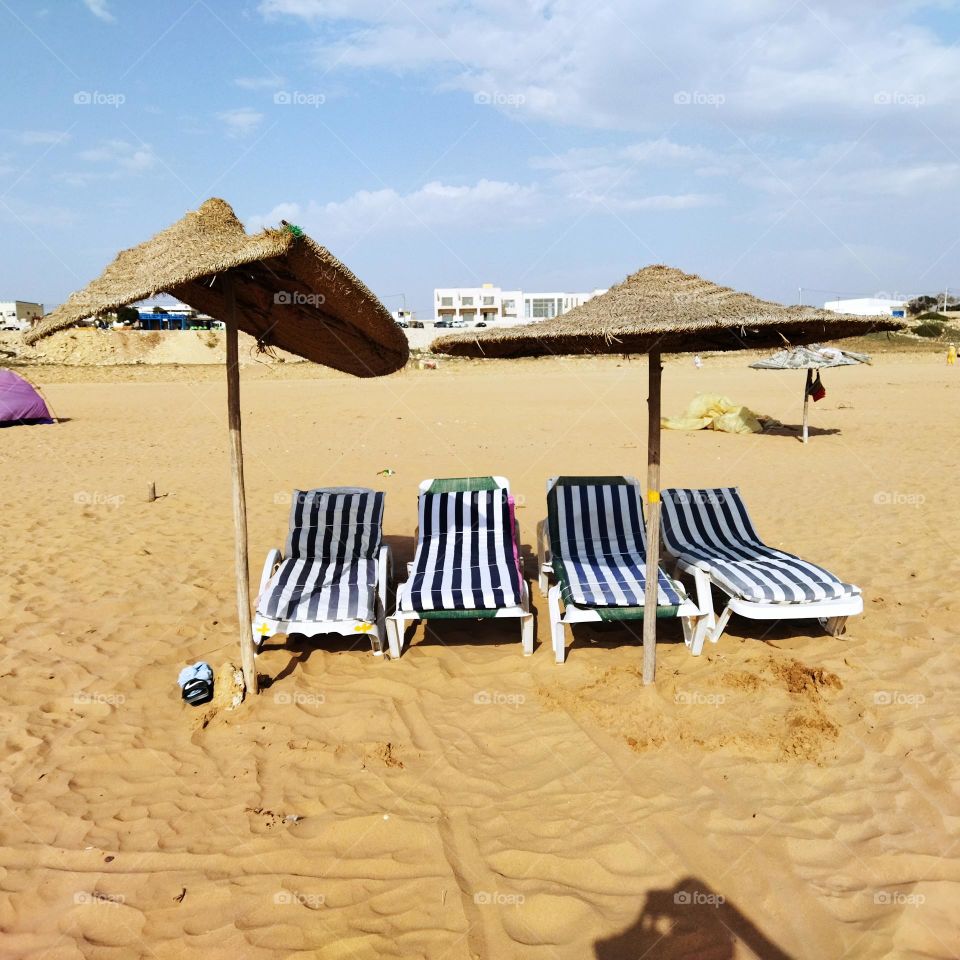 Beautiful seats near the beach in summer vacation.