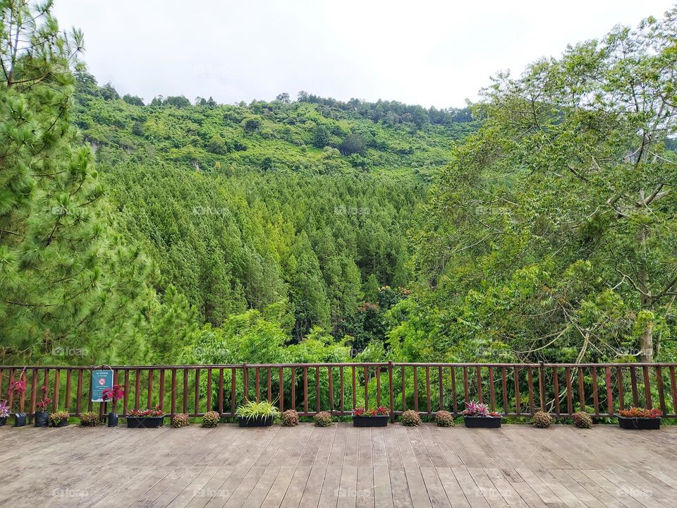 Beautiful hill view from restaurant terrace, with cloudy sky