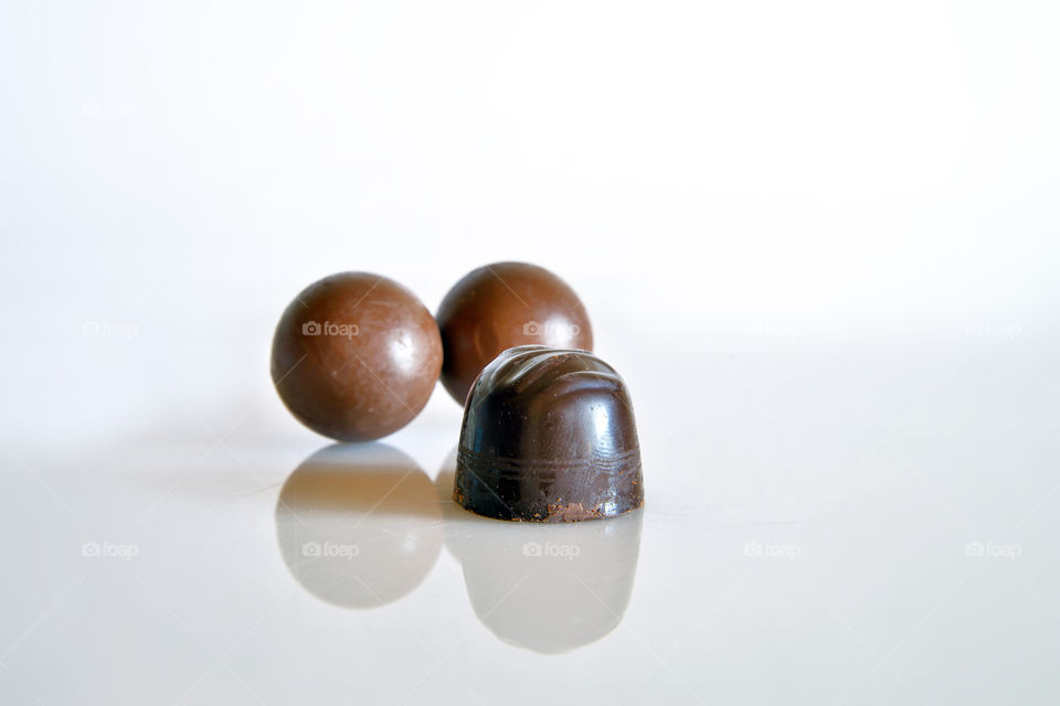 Chocolates against white background