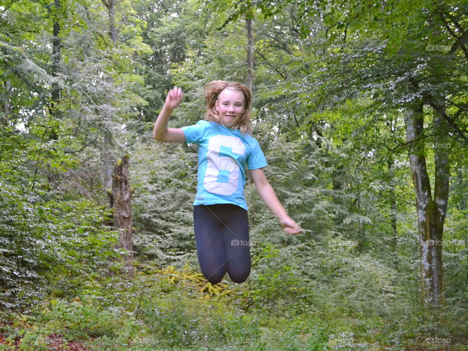 Girl jumping in the air of joy