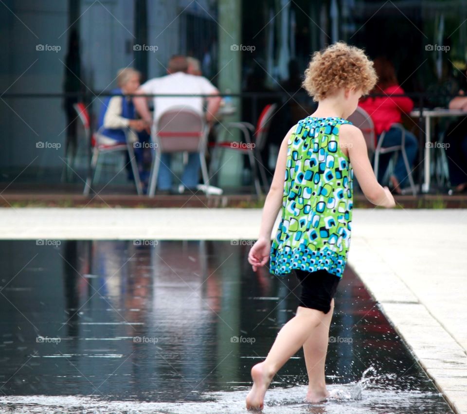 Girl Strolling in the Water Park