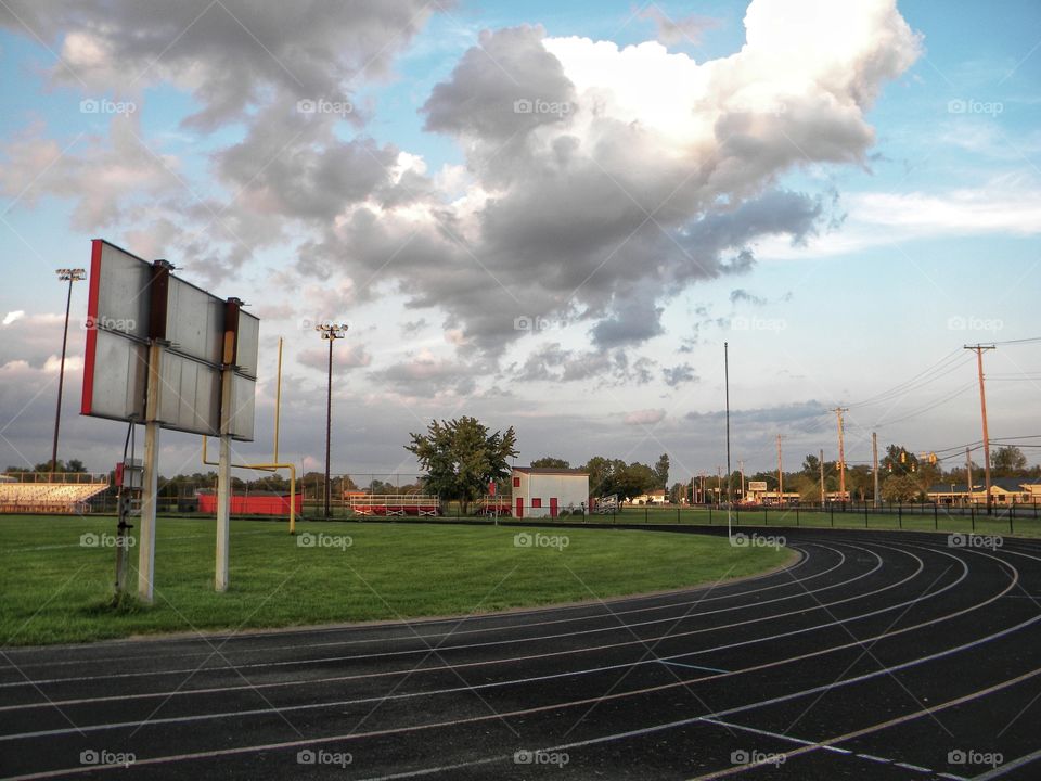High school track in summer evening.
