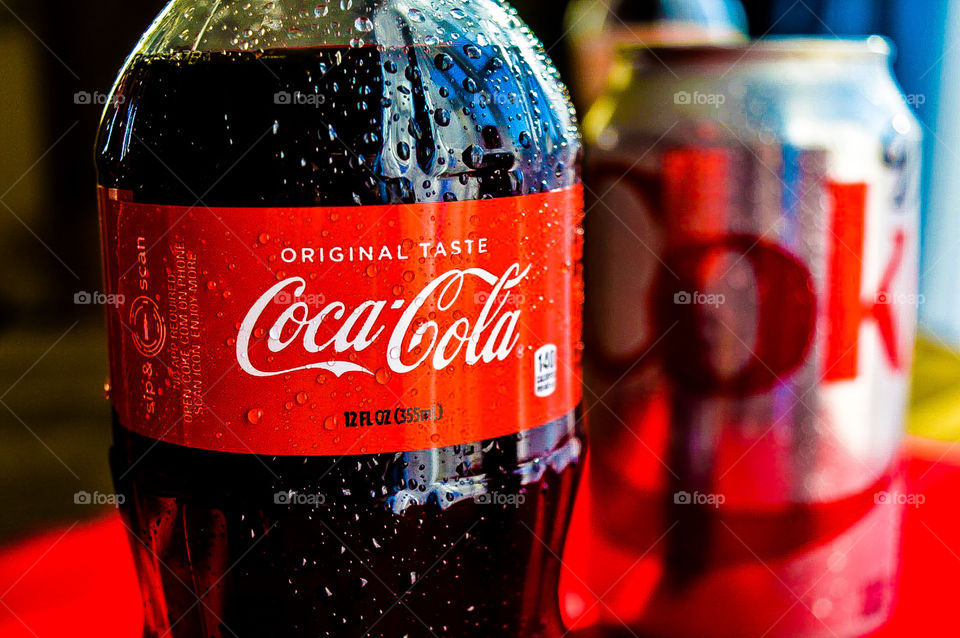 Coca-Cola with condensation drops and a Diet Coke