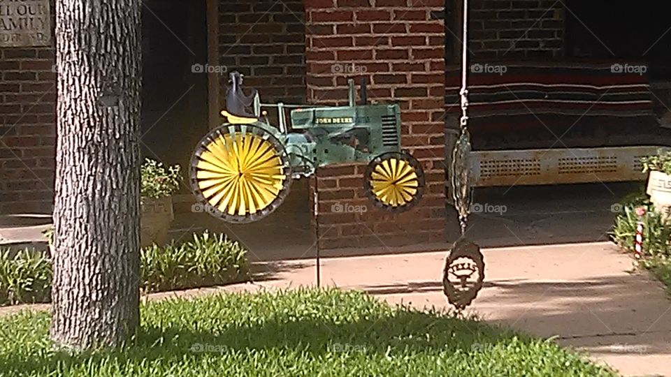 floating deer. this john deer tractor is actually a wind mill