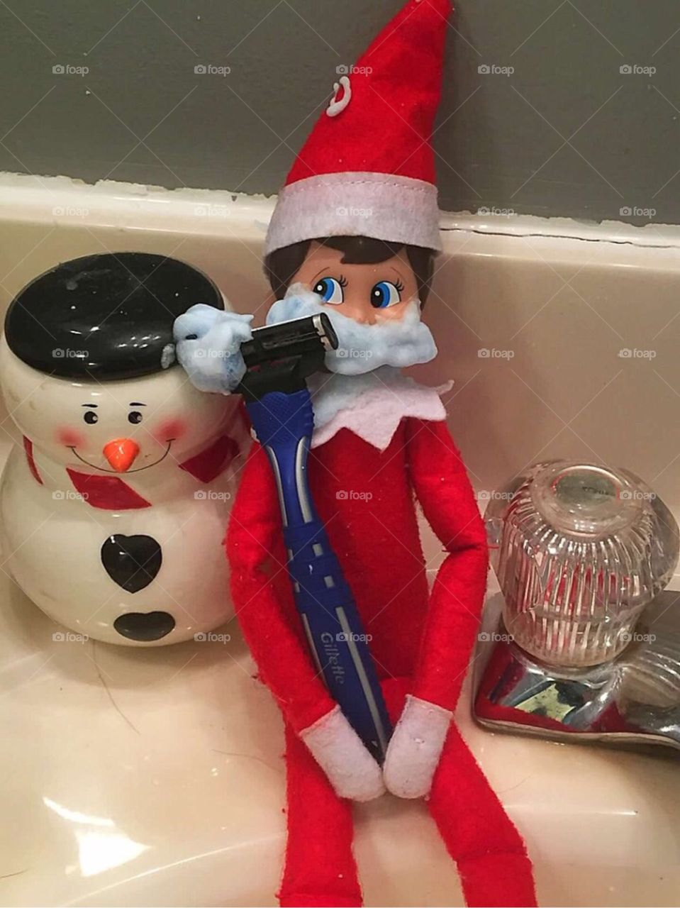 Our elf shaving his face 