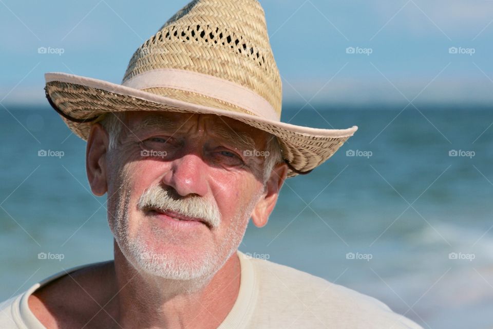Portrait of old man with hat