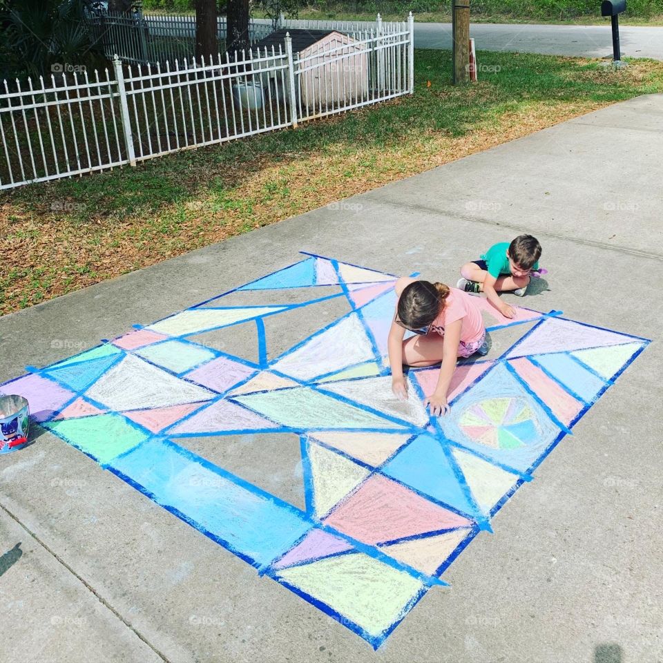During our quarantine fun we did chalk art. It took them quite awhile to finish. With bright colors all around. 