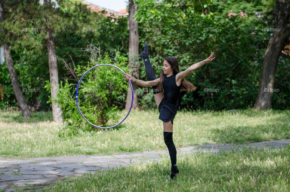 Beautiful Young Gimnast Dancing in Nature