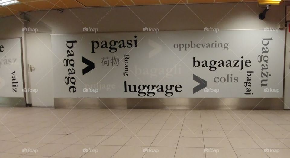 The hallway leading to the luggage lockers at Amsterdam Centraal Station in Amsterdam, Netherlands. Luggage in many languages ❤