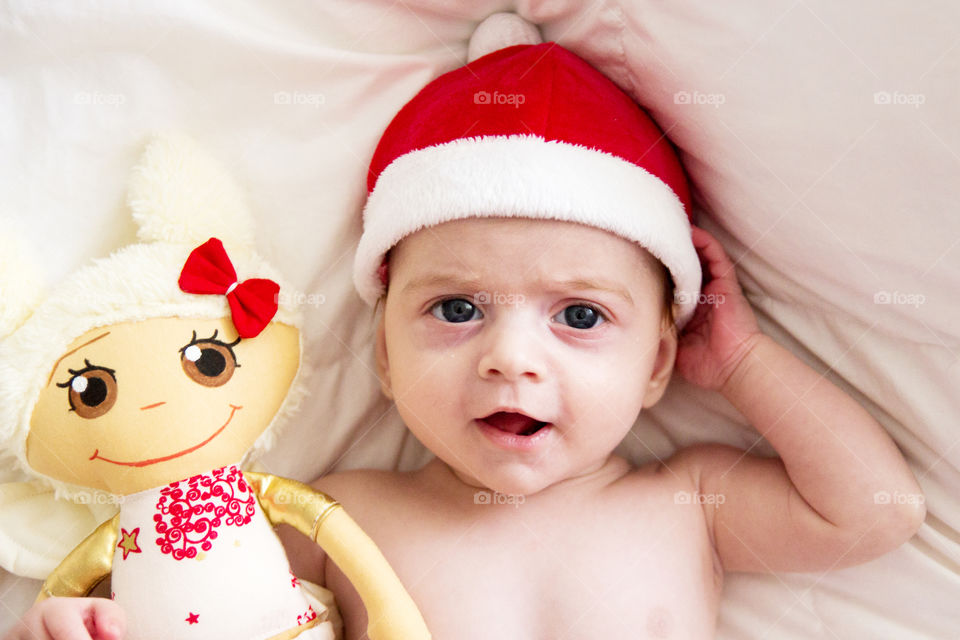 High angle view of baby wearing santa hat