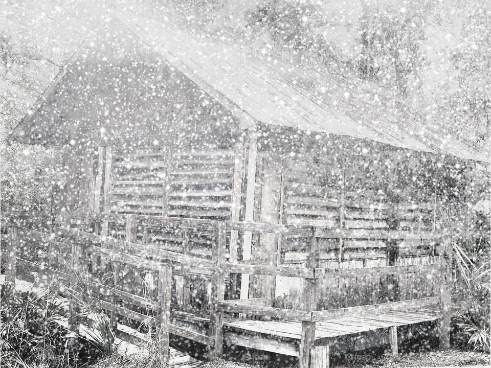 Little wooden cabin during a blizzard.