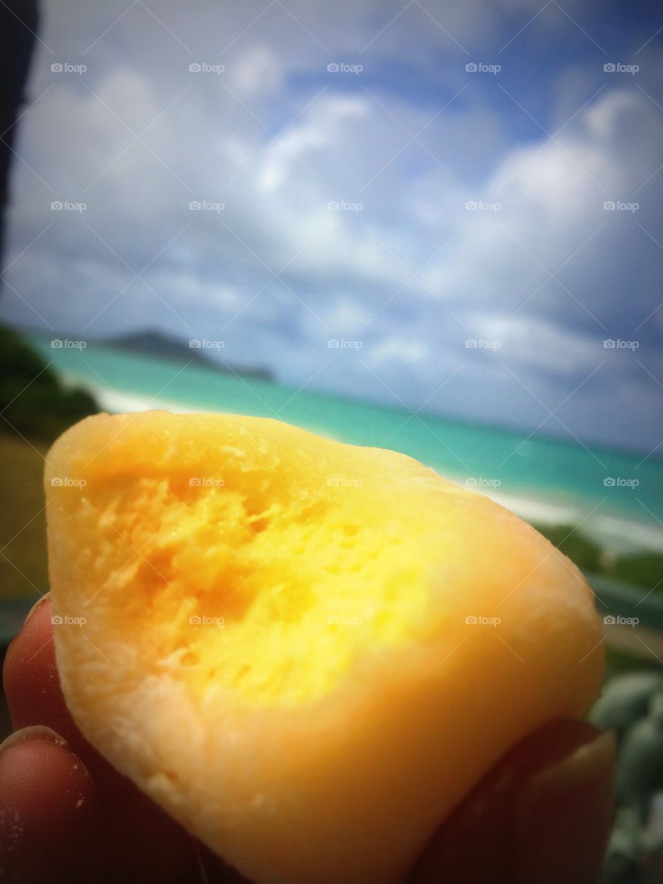 Eating mango mochi on the beach 